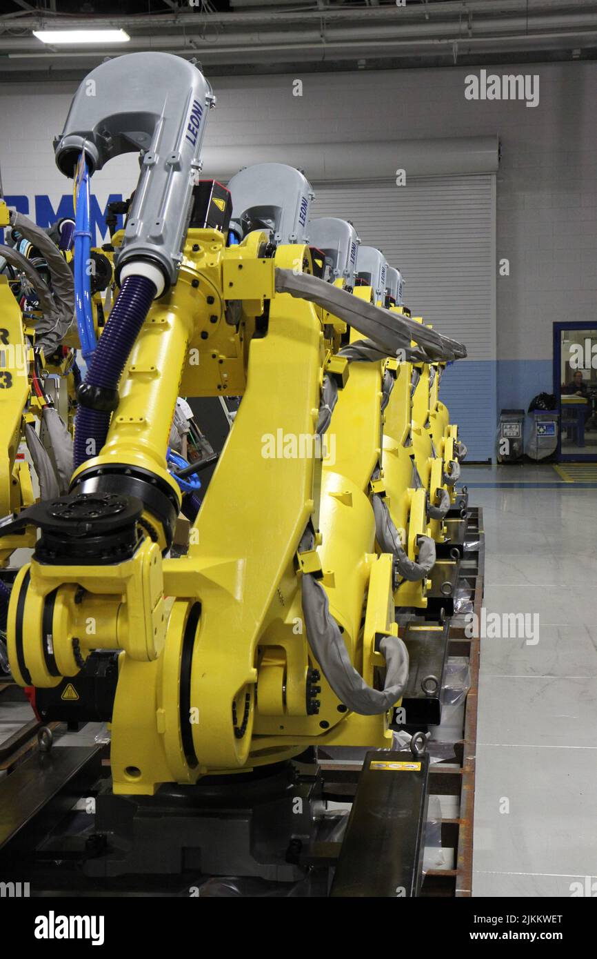 A closeup of yellow GE Fanuc robots Stock Photo