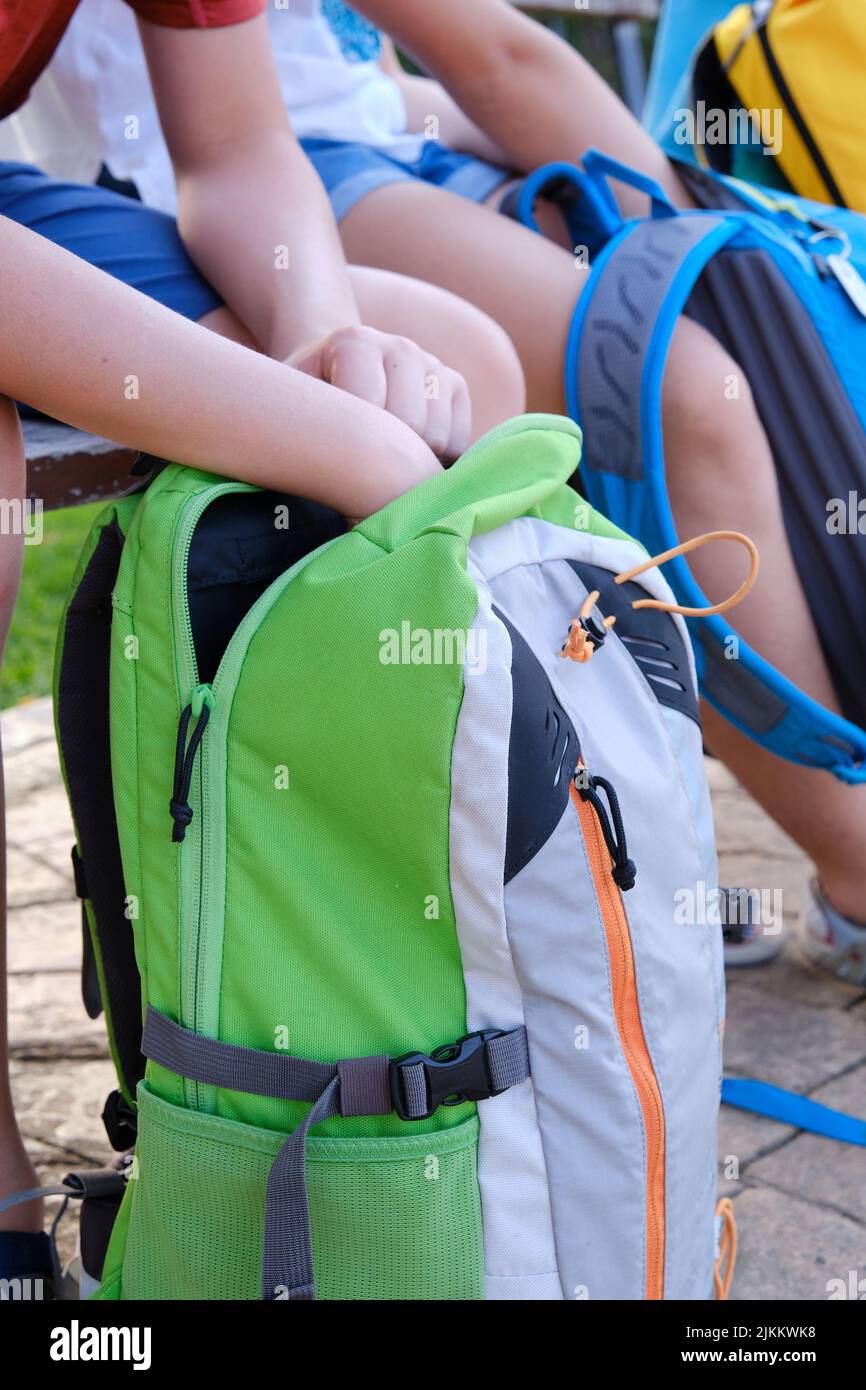 A Schoolchildren putting their homework folder in their backpacks Stock Photo