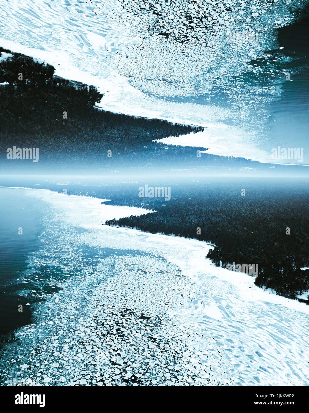 An inversion image of icy coastline during winter with blooming light ...