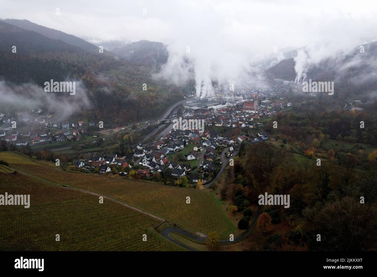 An aerial view of smoke from factory chimneys on a German valley Stock Photo