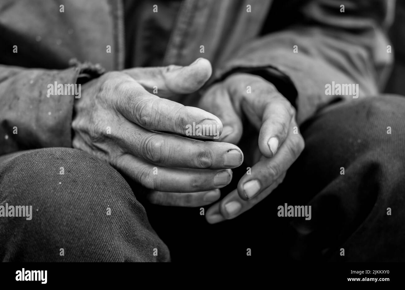 A black and white shot of dirty hands of an old man Stock Photo