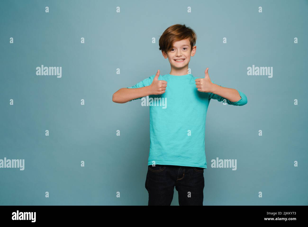 Ginger white boy wearing long sleeve smiling and showing thumbs up ...