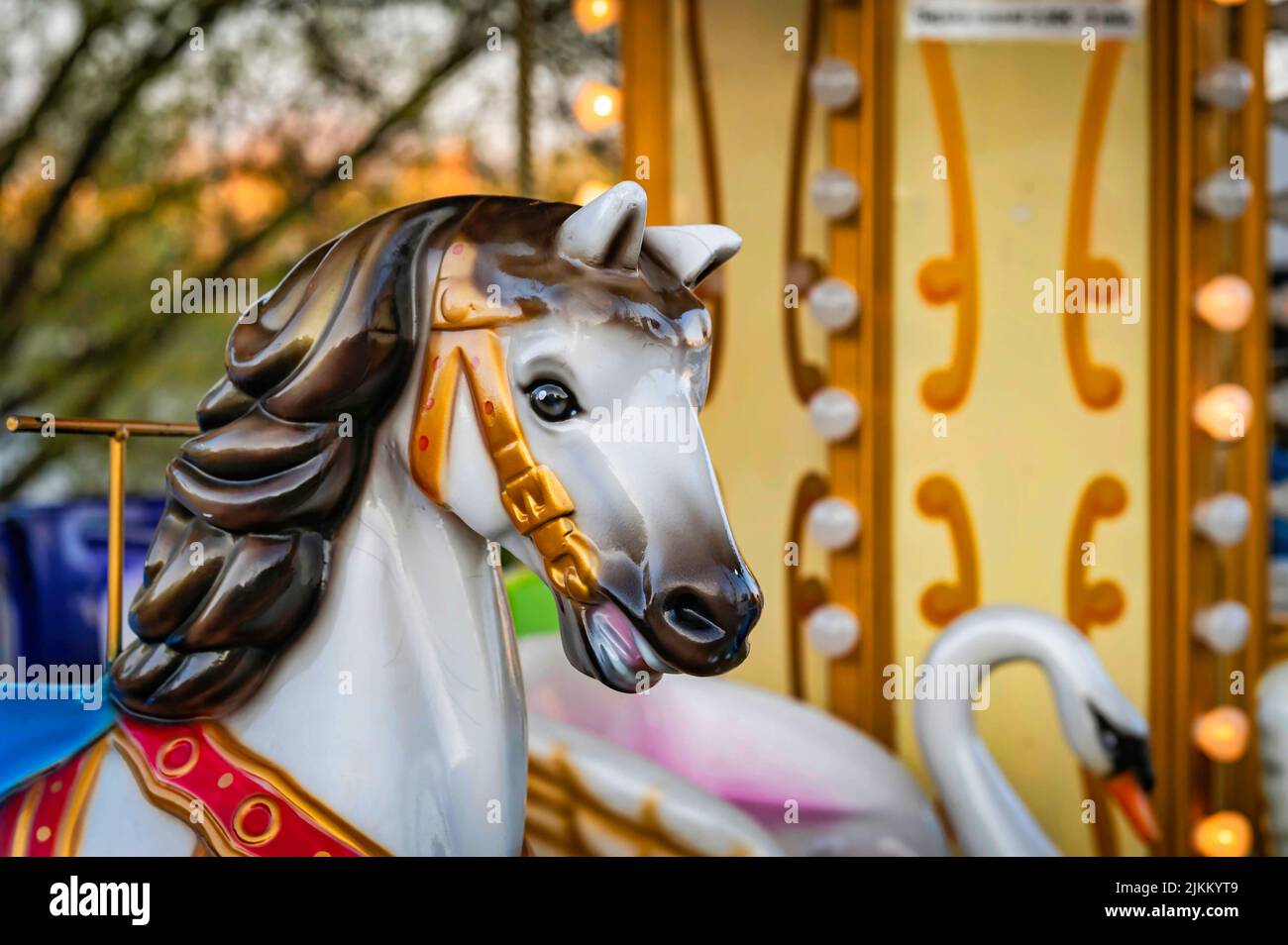 A merry - go - round horse at the fairground .The old carousel in the park of culture and recreation. Stock Photo