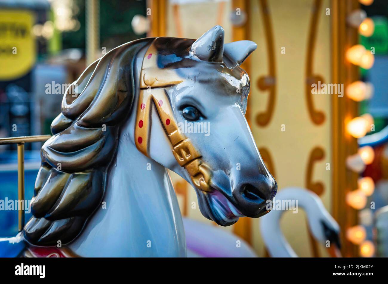 A merry - go - round horse at the fairground .The old carousel in the park of culture and recreation. Stock Photo