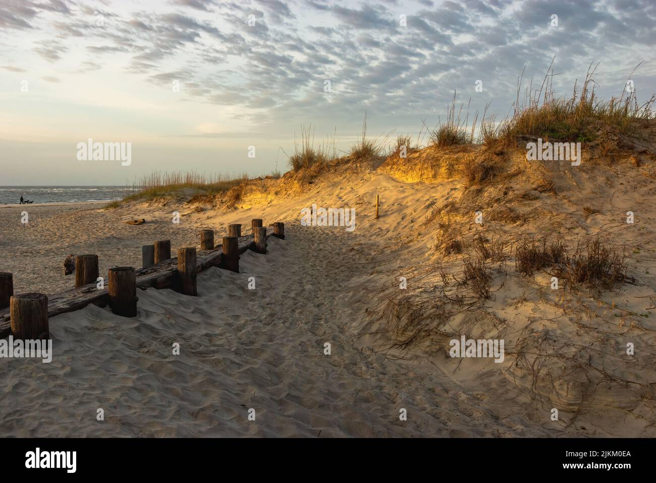 A sandy beach under the cloudy sky Stock Photo - Alamy