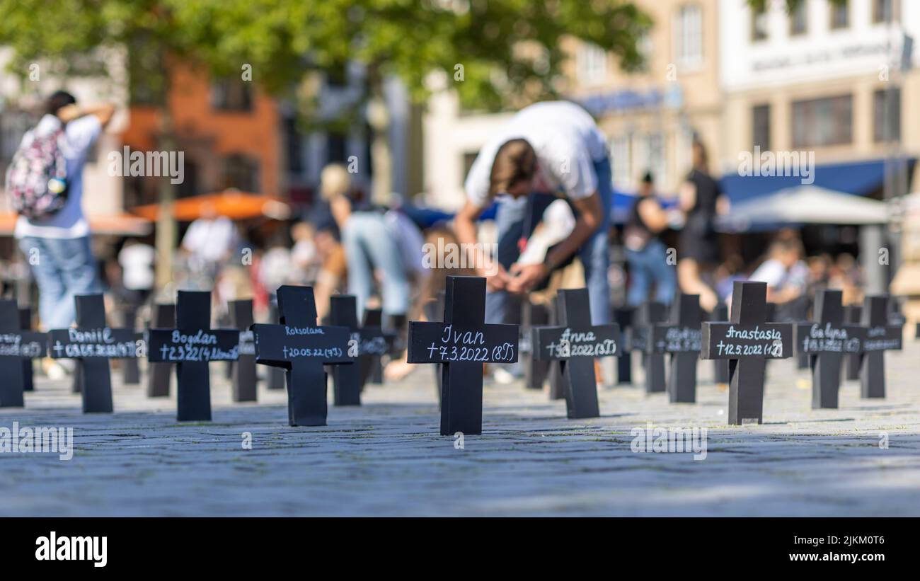 A sea of crosses reminding of child victims of war in Ukraine Stock Photo
