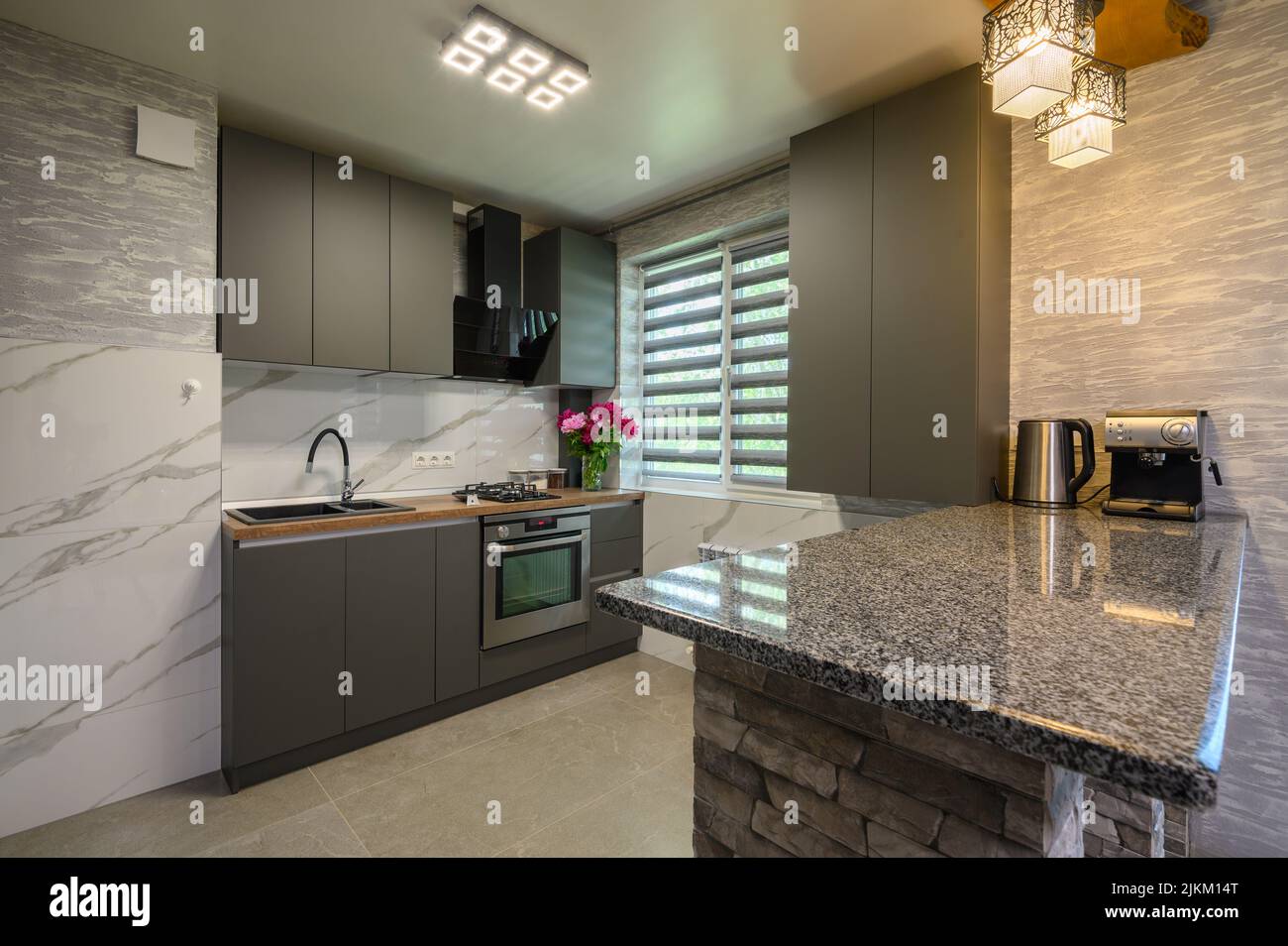 Interior of modern trendy grey kitchen Stock Photo - Alamy