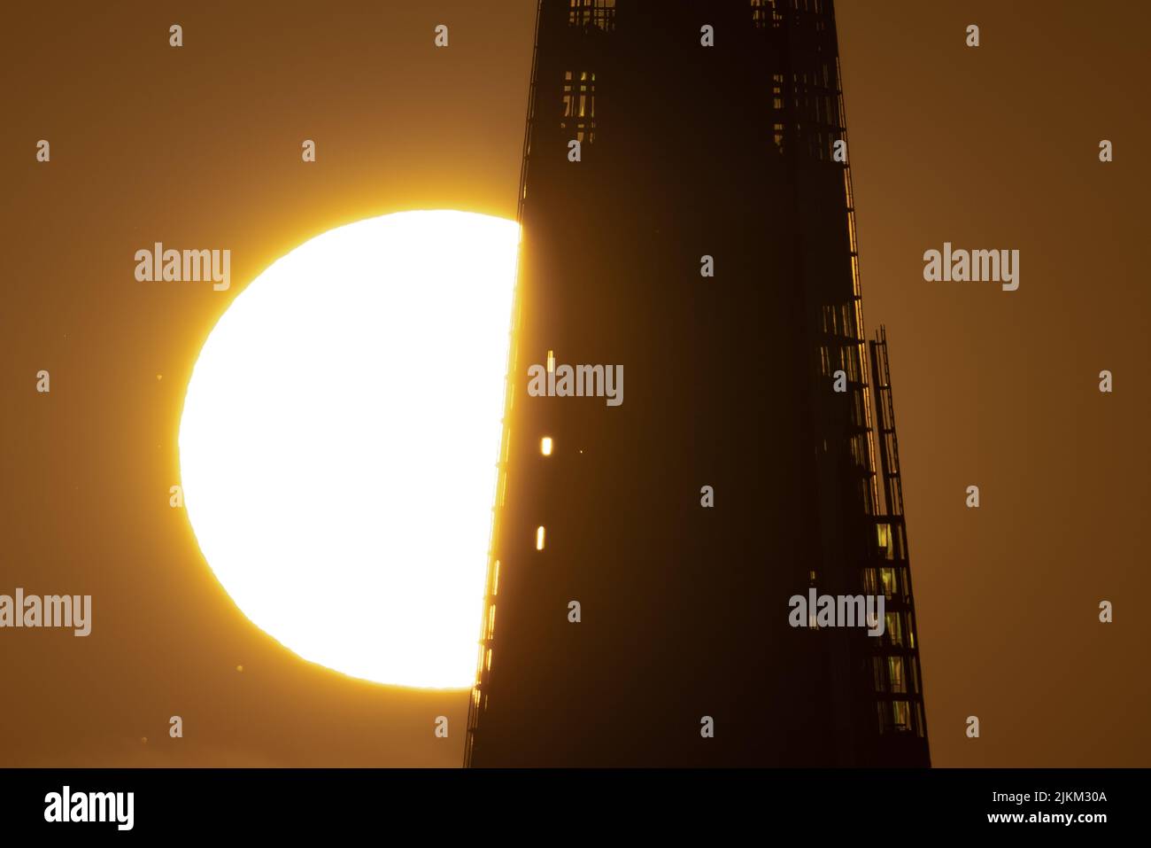 London, UK. 2nd August, 2022. UK Weather: Dramatic sunset behind The Shard skyscraper. Credit: Guy Corbishley/Alamy Live News Stock Photo