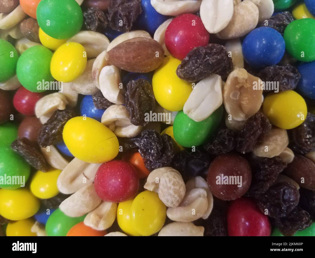 Colorful mixed candies and nuts and raisins in bulk Stock Photo Alamy