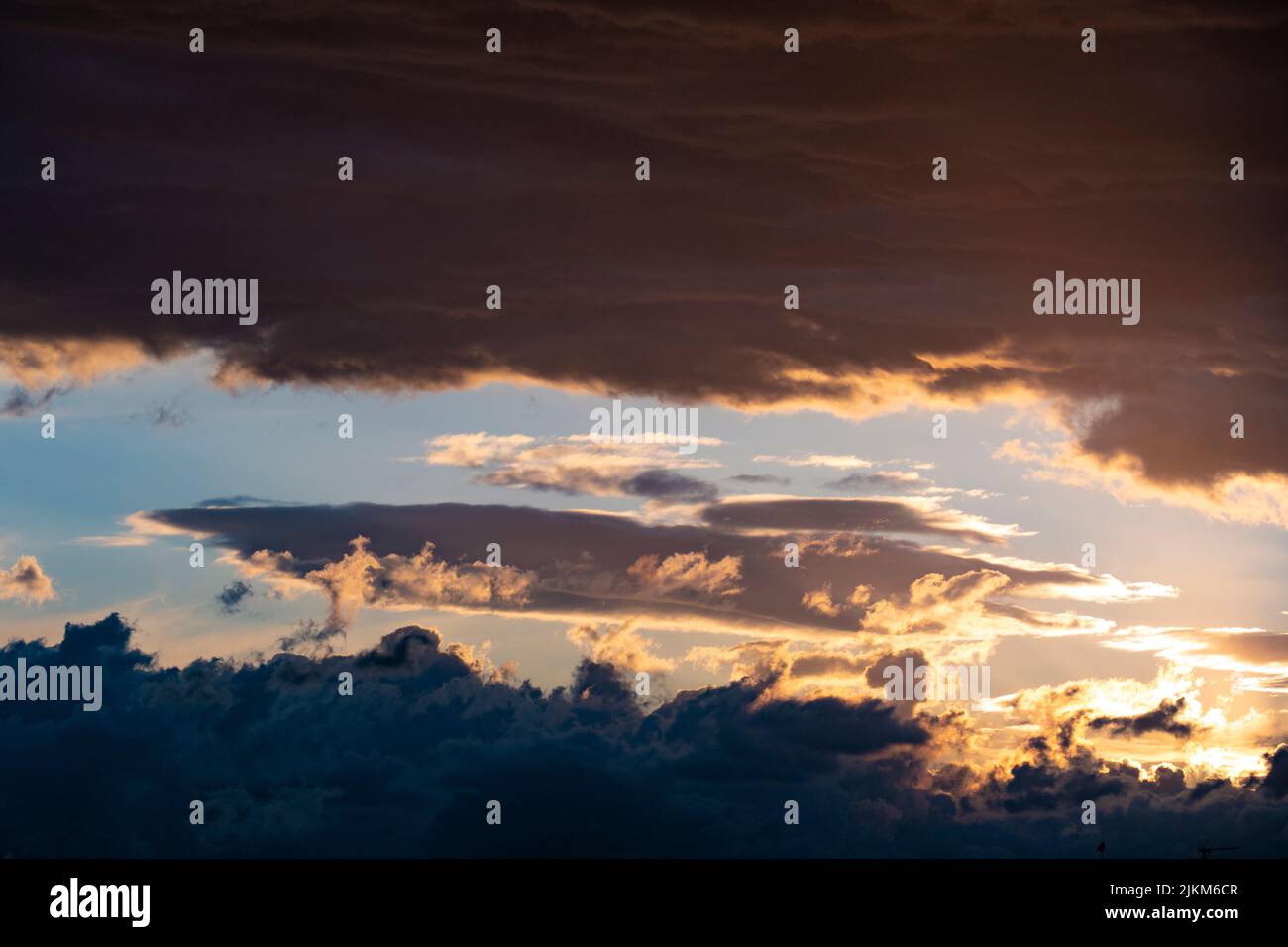 Dark clouds sunset lights hi-res stock photography and images - Alamy