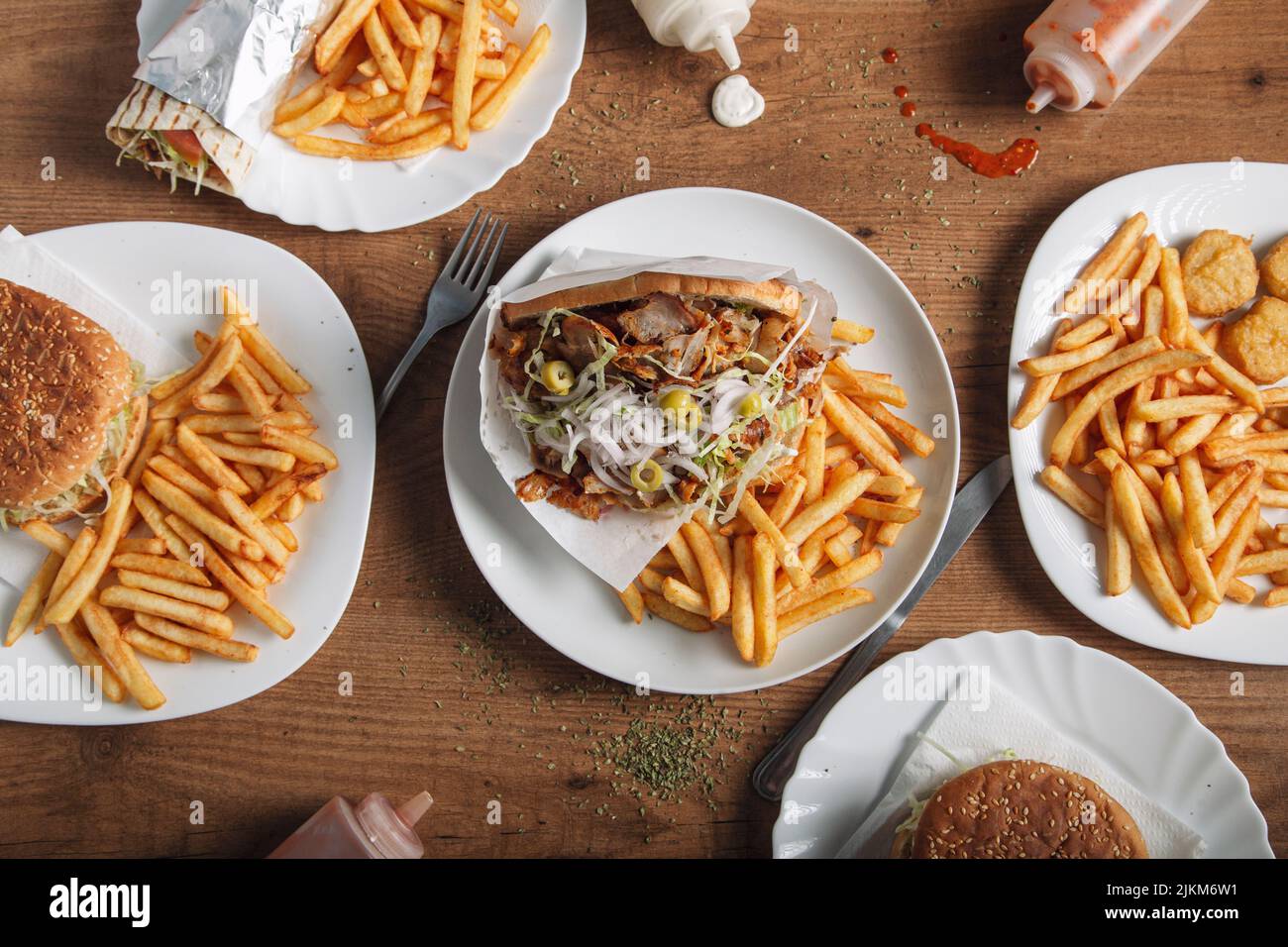 Various fast food dishes. Pita, burgers and nuggets. Stock Photo