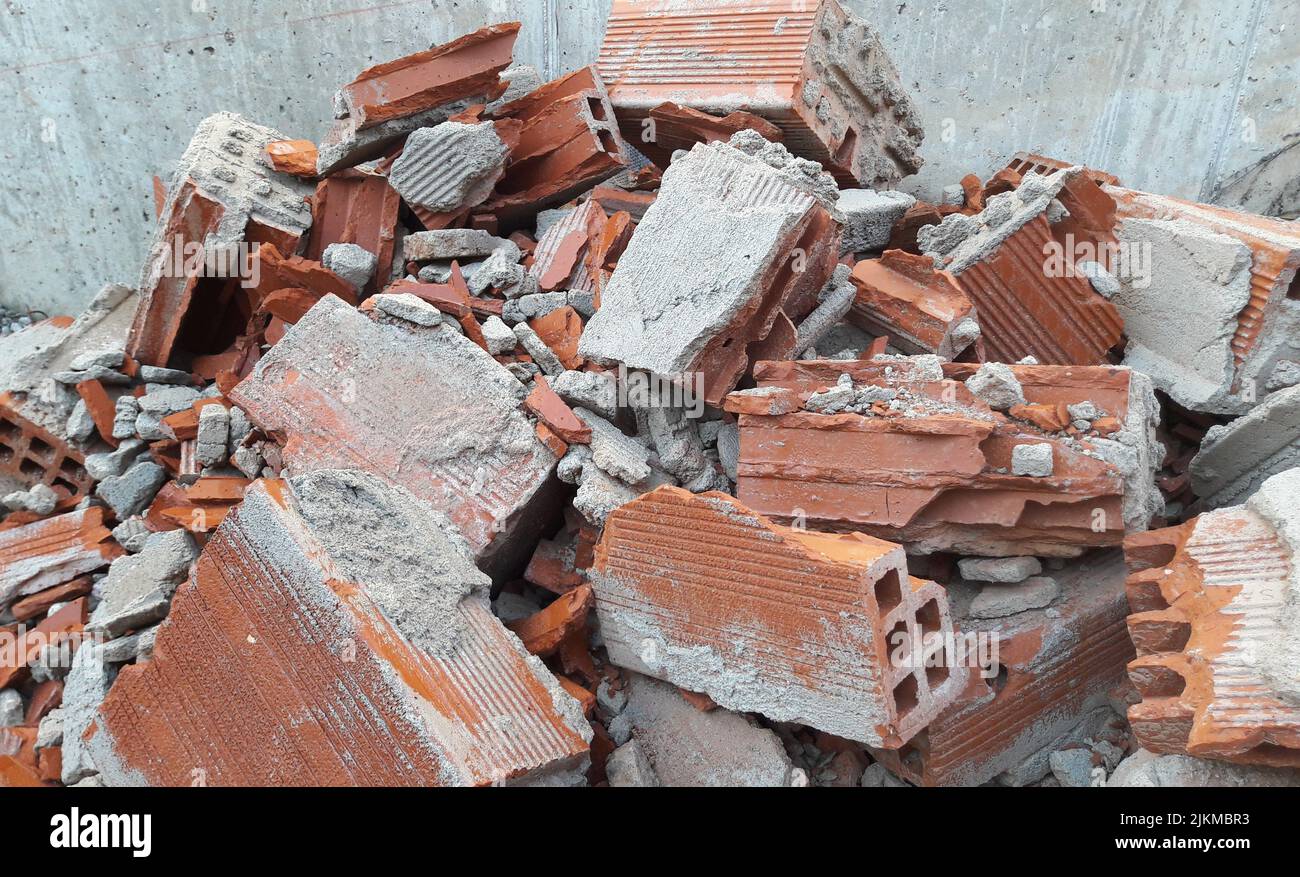 A pile of broken bricks against a wall Stock Photo Alamy