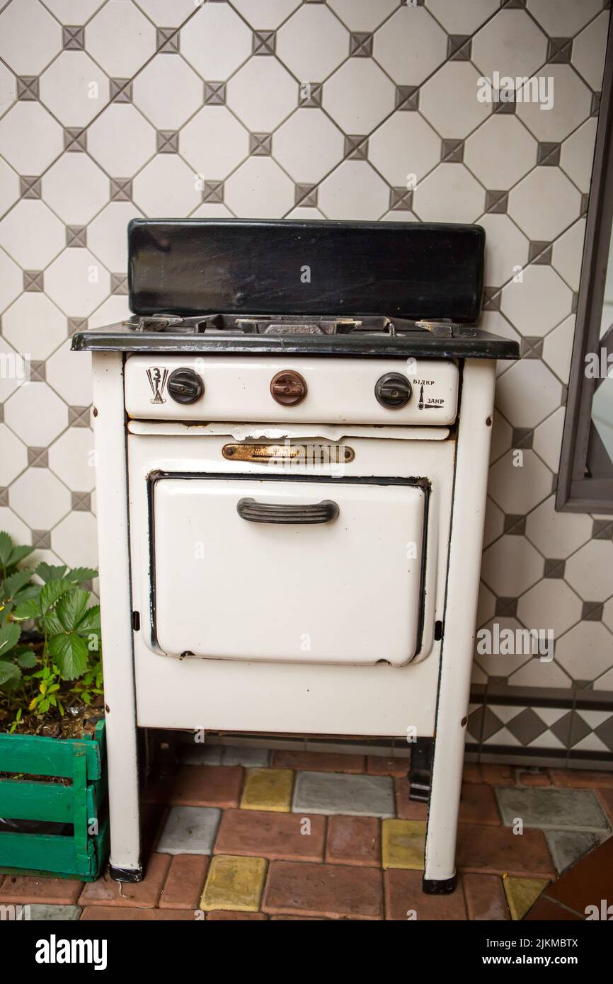Old vintage gas cooker. Ancient vintage gas stove Stock Photo