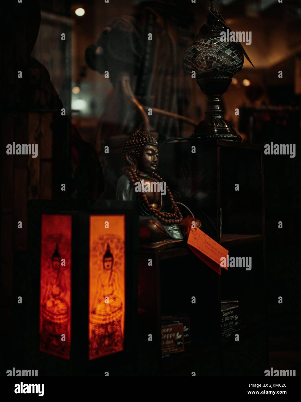 A vertical closeup shot of a Budha statuette Stock Photo