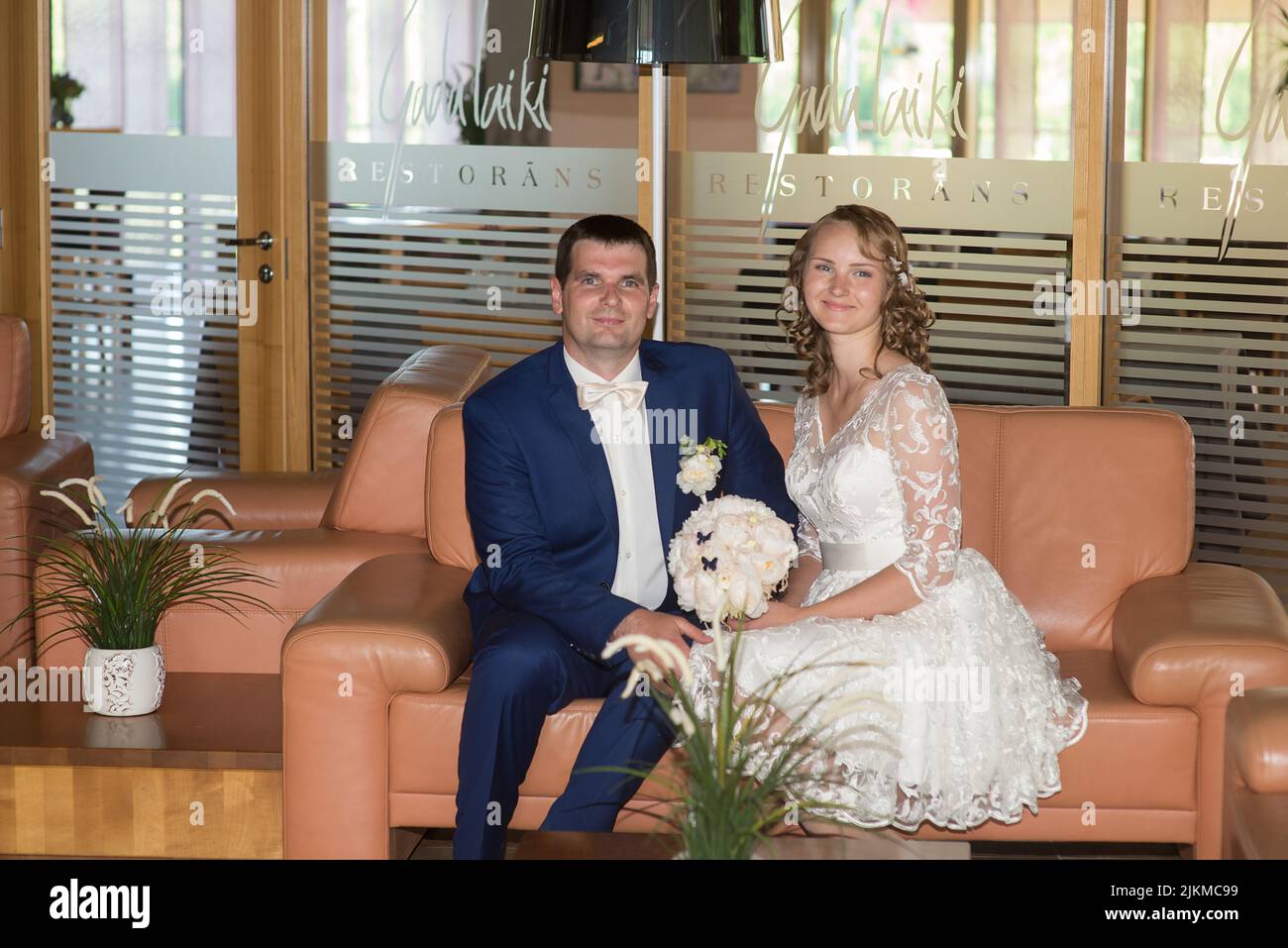 Bride sitting on couch hi-res stock photography and images - Alamy