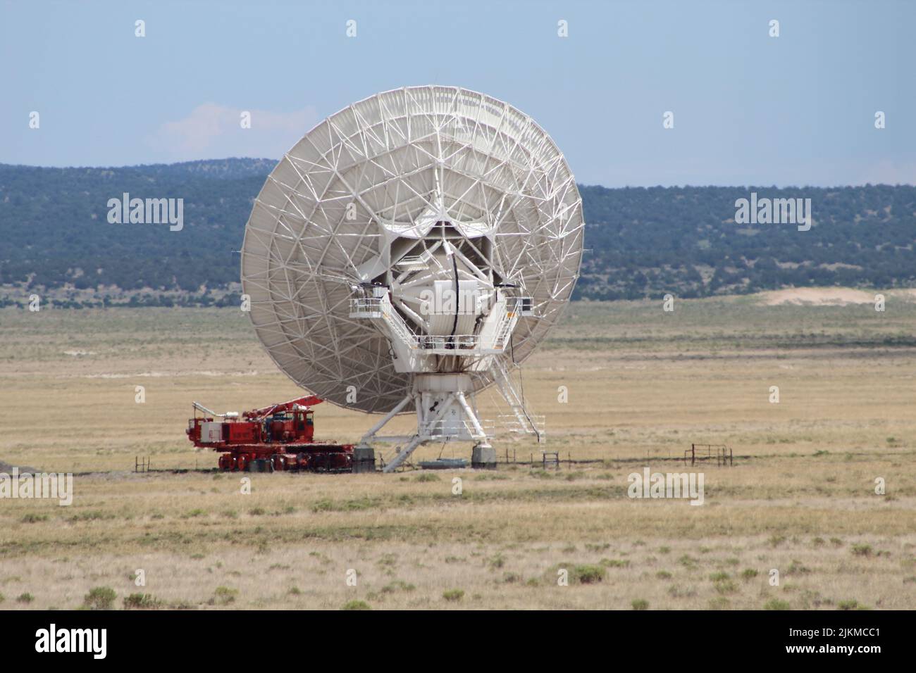 A big antenna being prepared to move to a new position by the special tractor Stock Photo