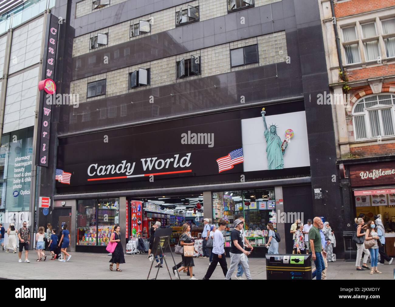 Pedestrians pass by Candy World, which has taken over the site of the former flagship HMV store on Oxford Street. Concern is growing over the many so-called 'American candy shops' which have proliferated around central London. Stock Photo