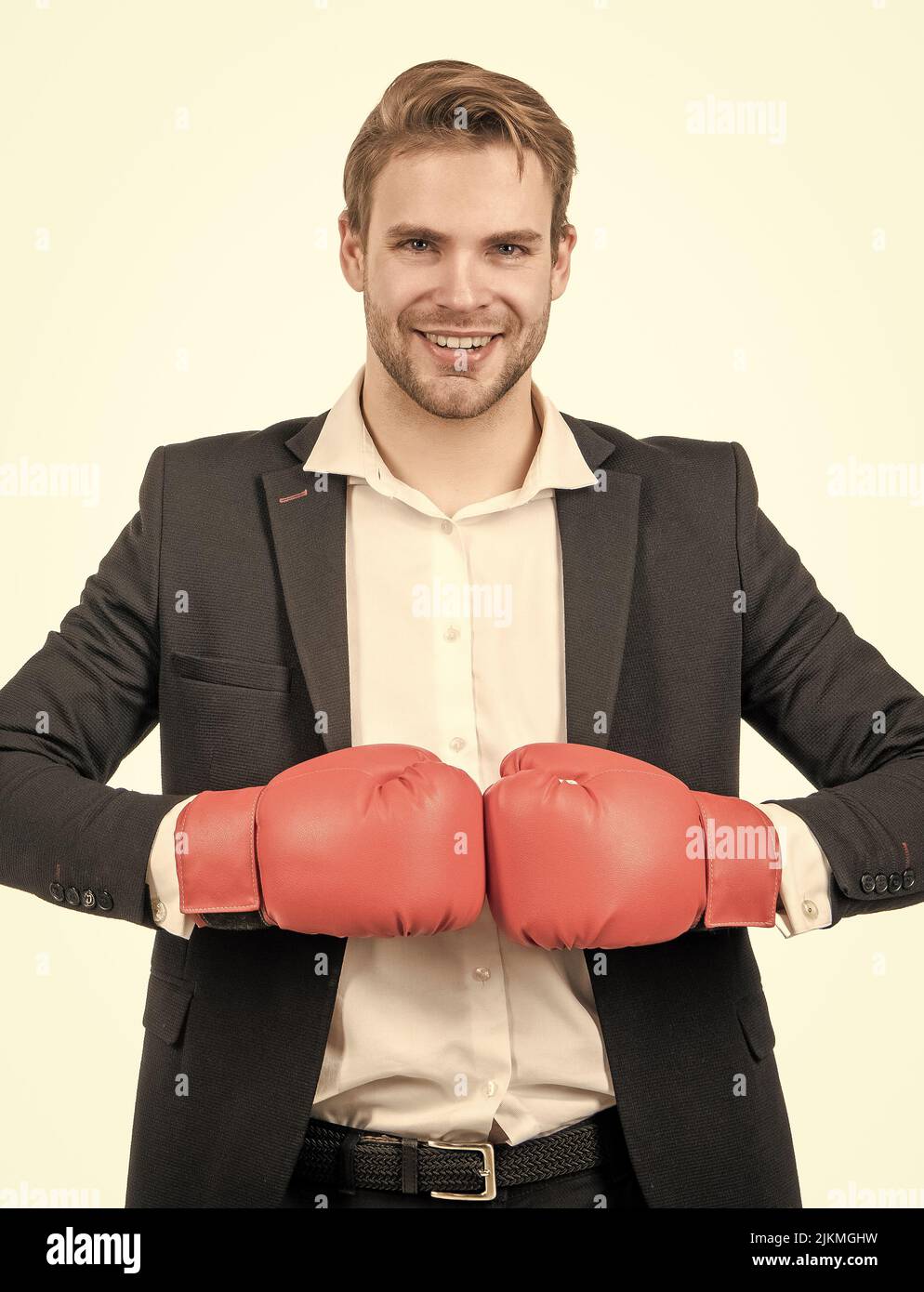 Keep fighting the good fight. Happy businessman hold boxing gloves