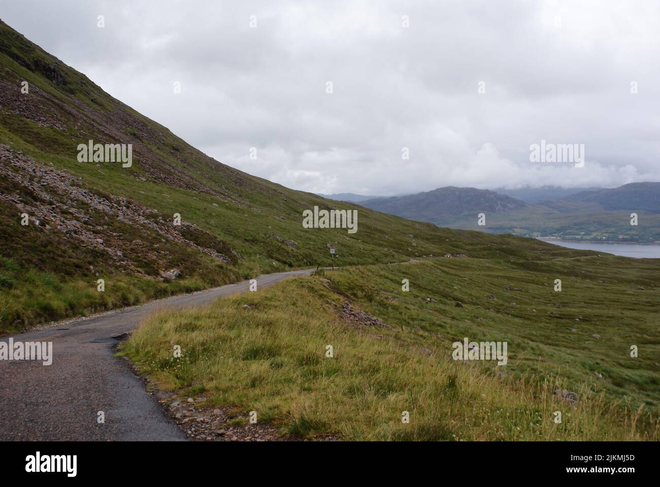 A scenic view of highway road along hilly terrains in Scotland Stock