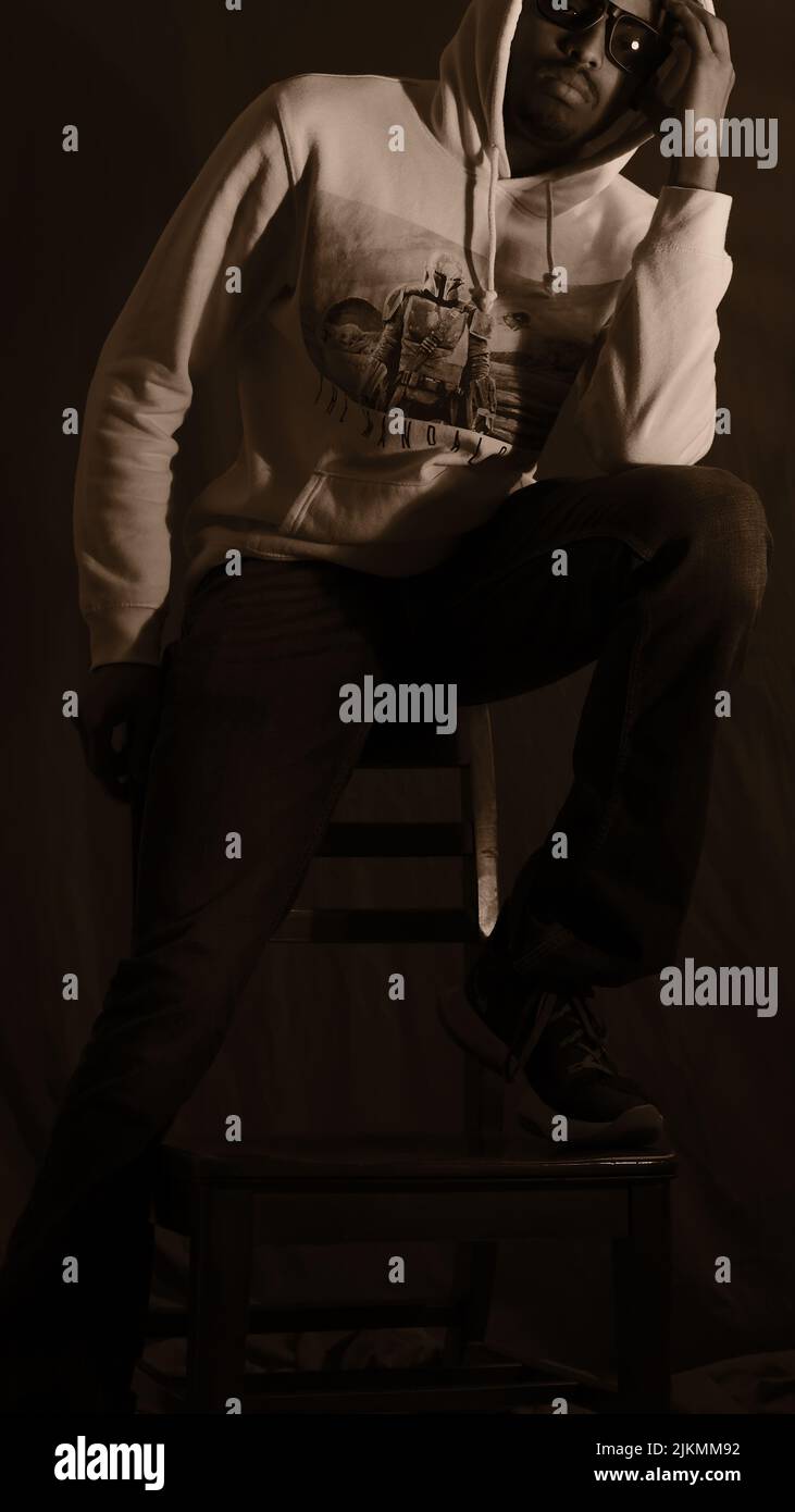 A cool young African American young guy posing in a studio Stock Photo