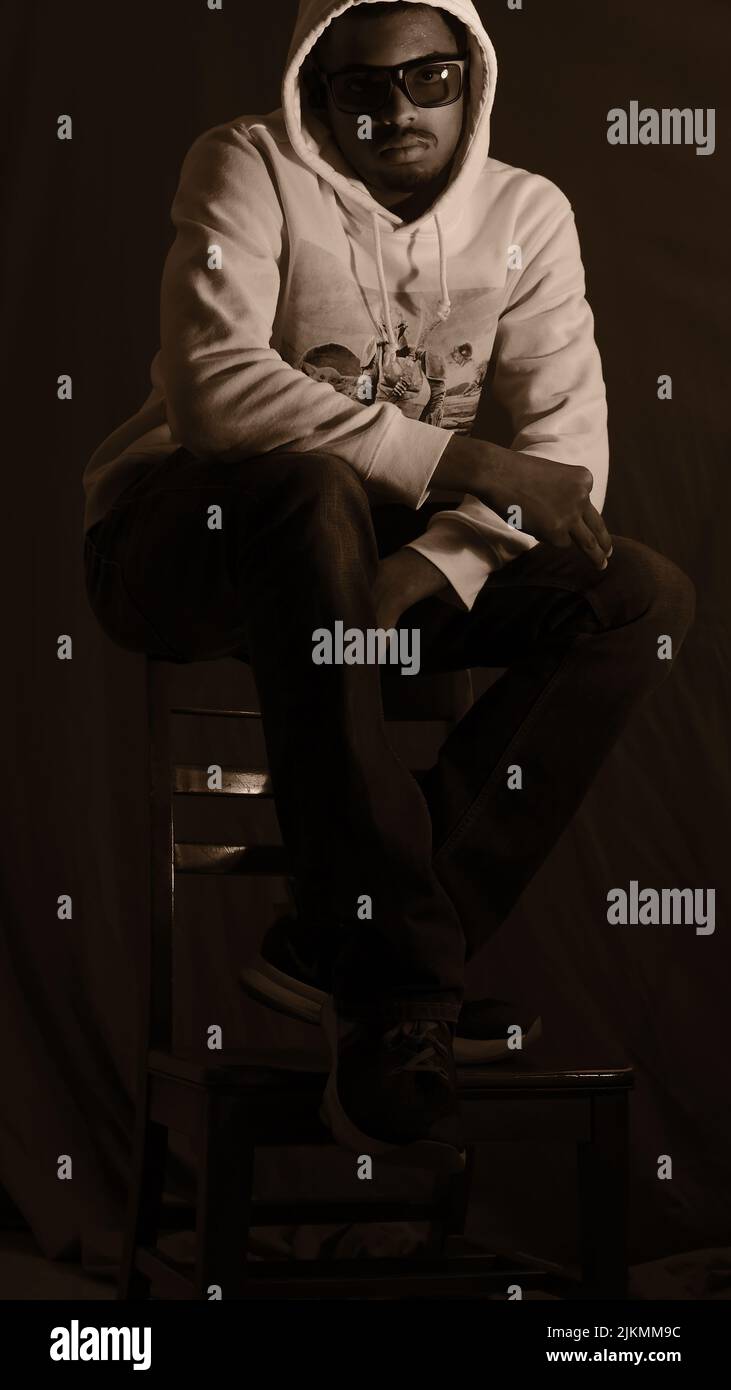 A cool young African American young guy posing in a studio Stock Photo