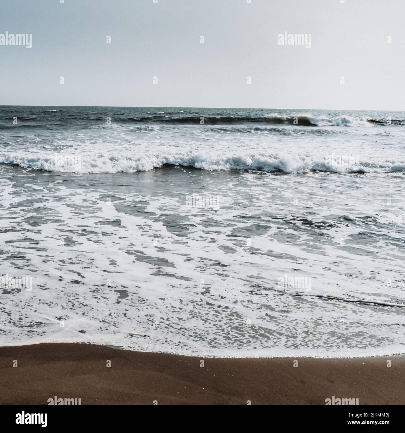 A Sandy Shore And Calm Waves In Guatemala, Central America Stock Photo 