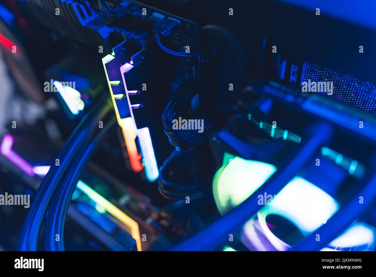Inside of professional gaming computer with glowing parts in rainbow