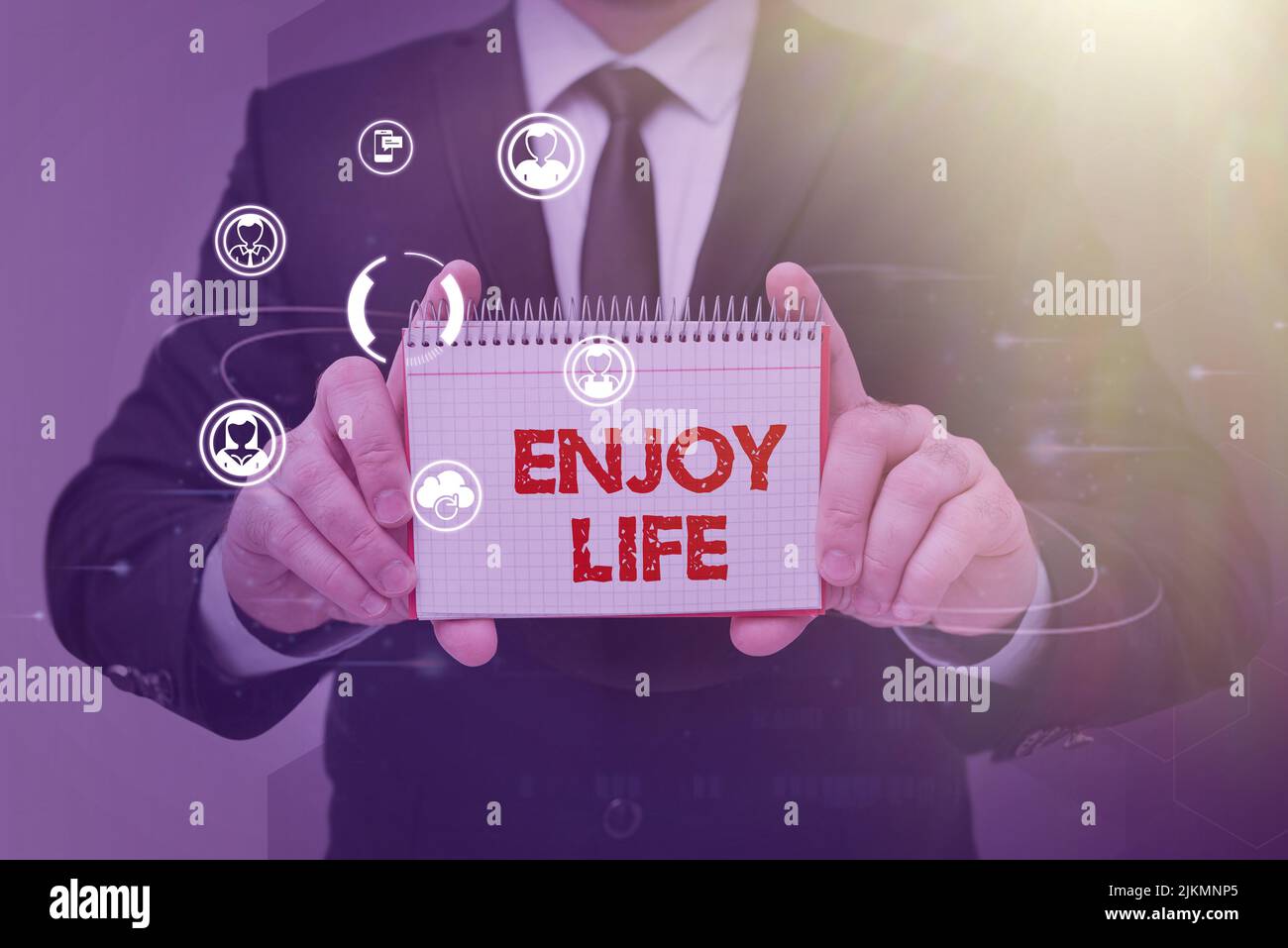 Conceptual display Enjoy Life. Concept meaning Any thing, place,food or person, that makes you relax and happy Businessman in suit holding notepad Stock Photo