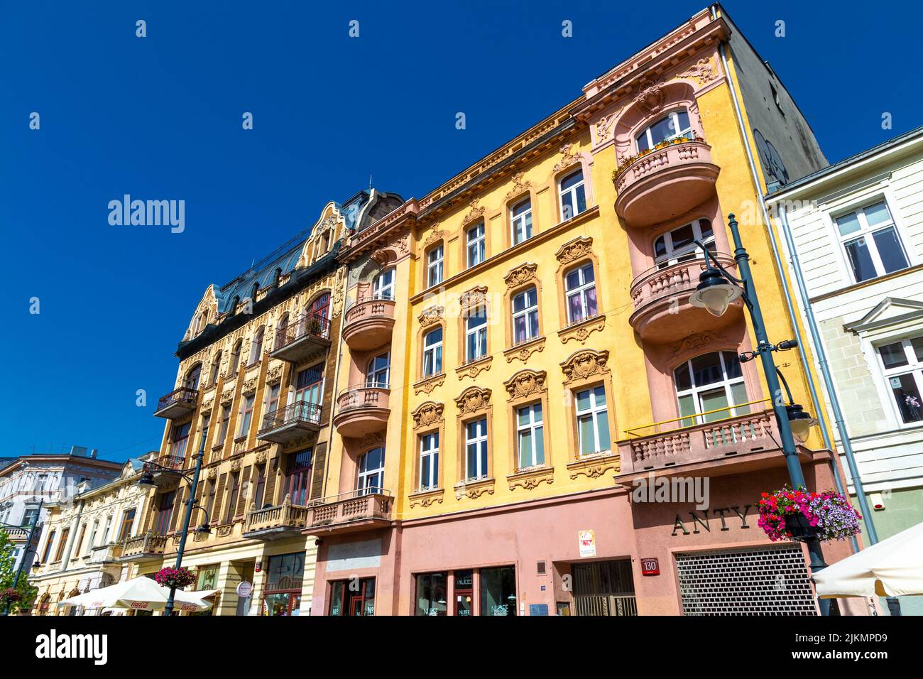 Colourful, ornate art nouveau tenement houses on Piotrkoswska Street, Lodz, Poland Stock Photo