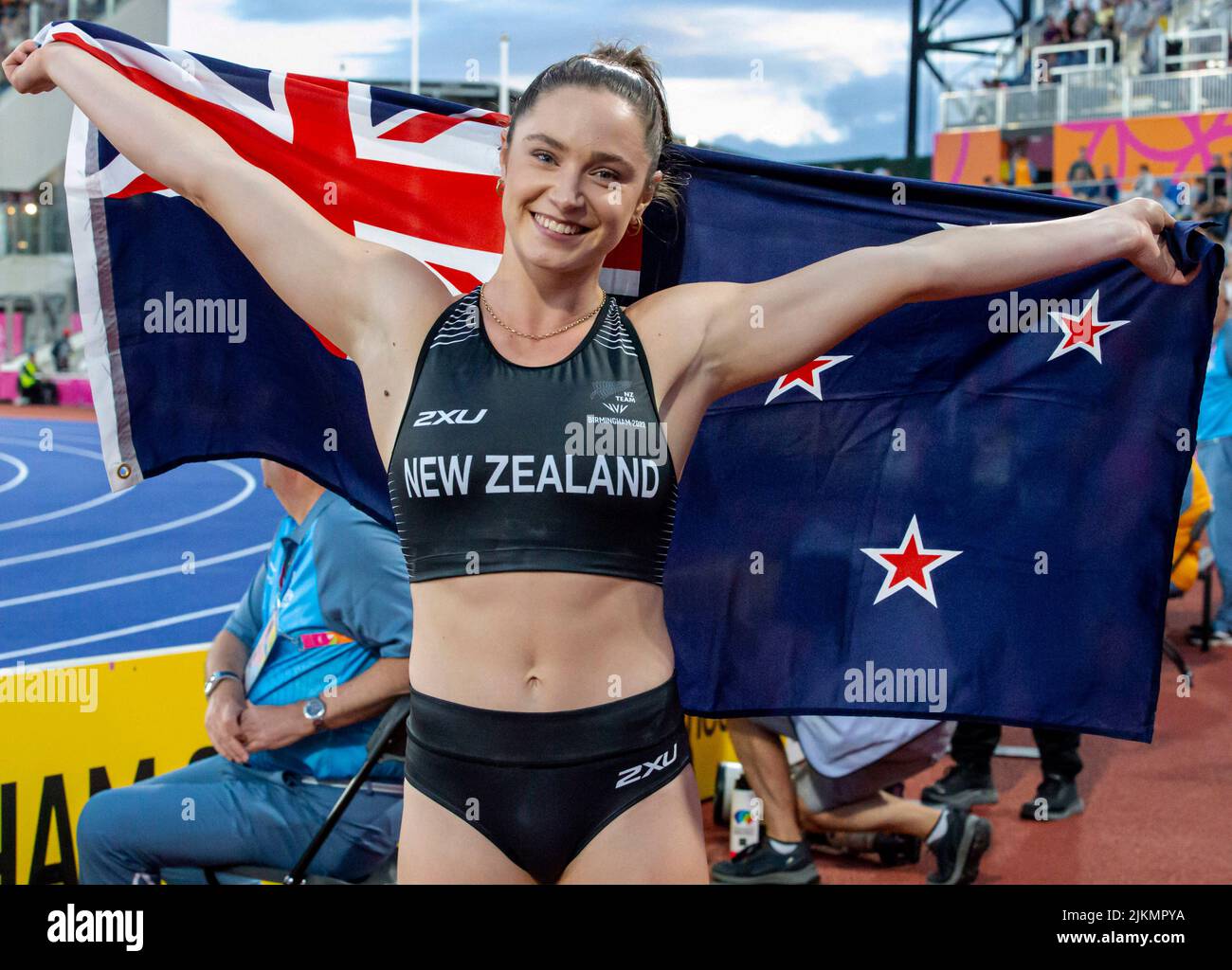 Birmingham, UK. 2nd August 2022; Alexander Stadium, Birmingham, Midlands, England: Day 5 of the 2022 Commonwealth Games: Imogen Ayris (NZL) with her national flag celebrates after winning the Bronze Medal in the Pole Vault with a height of 4.45m Credit: Action Plus Sports Images/Alamy Live News Stock Photo