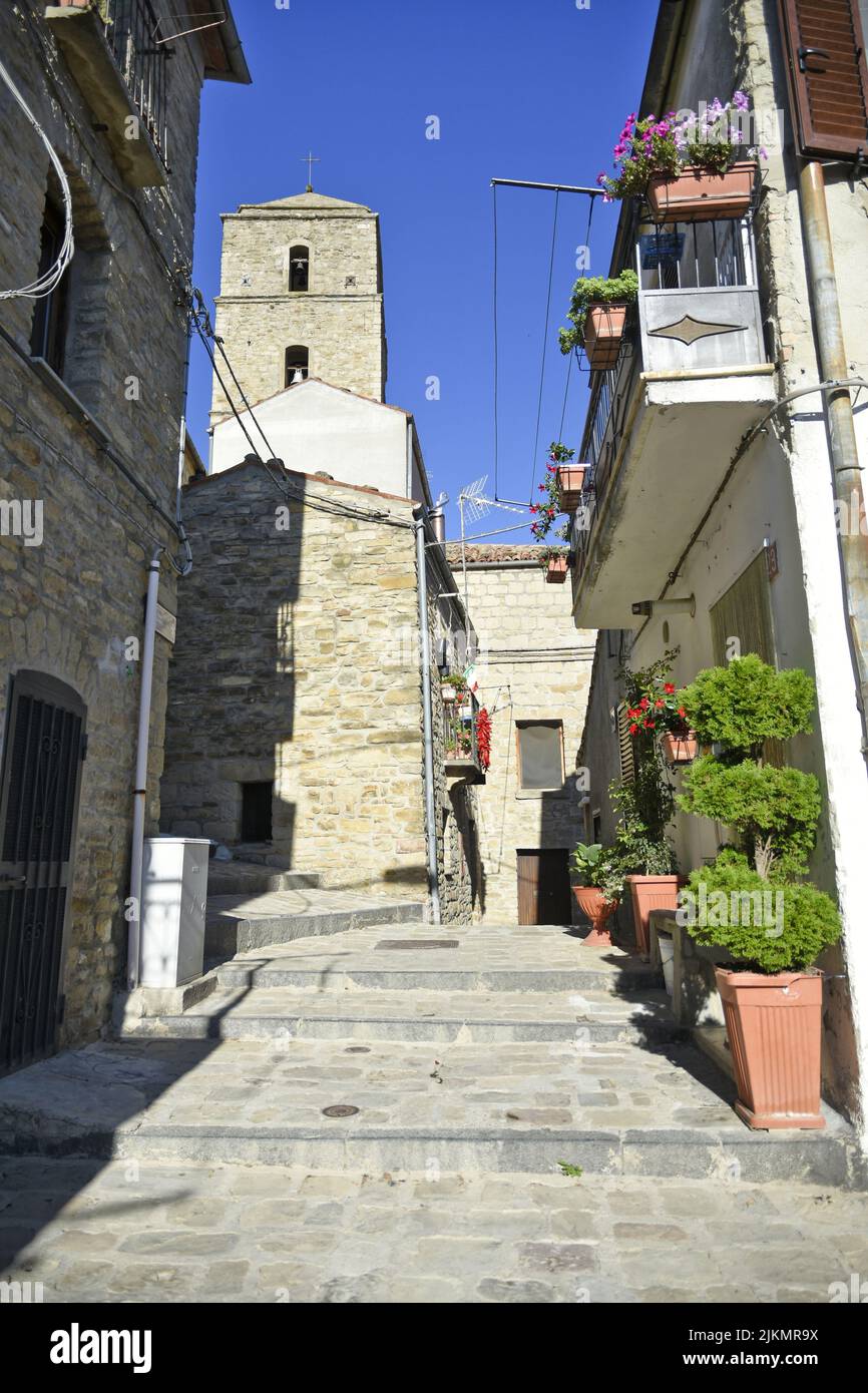 A vertical narrow street among the old houses of Pietrapertosa, a medieval village in Basilicata Stock Photo