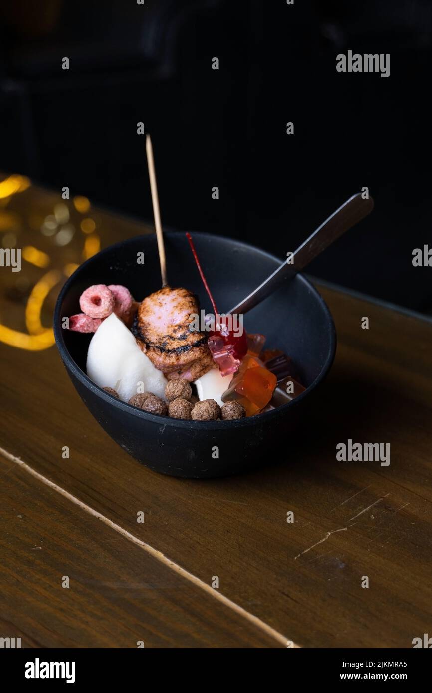 ice dessert with sweet toppings, burnt marshmallow, colored cereal