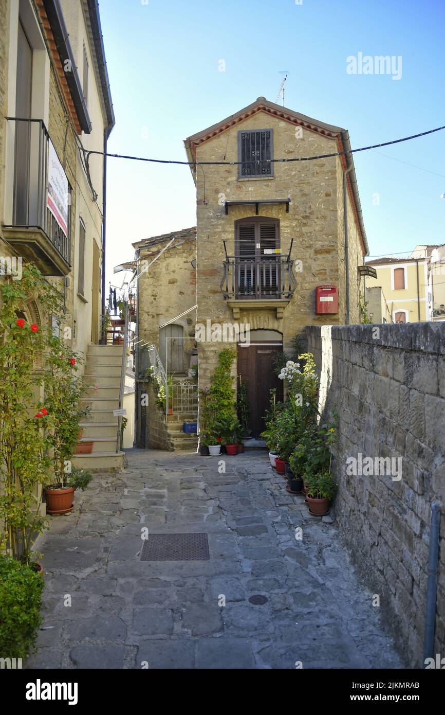 A narrow street among the old houses of Pietrapertosa, a medieval village in the Basilicata region Stock Photo