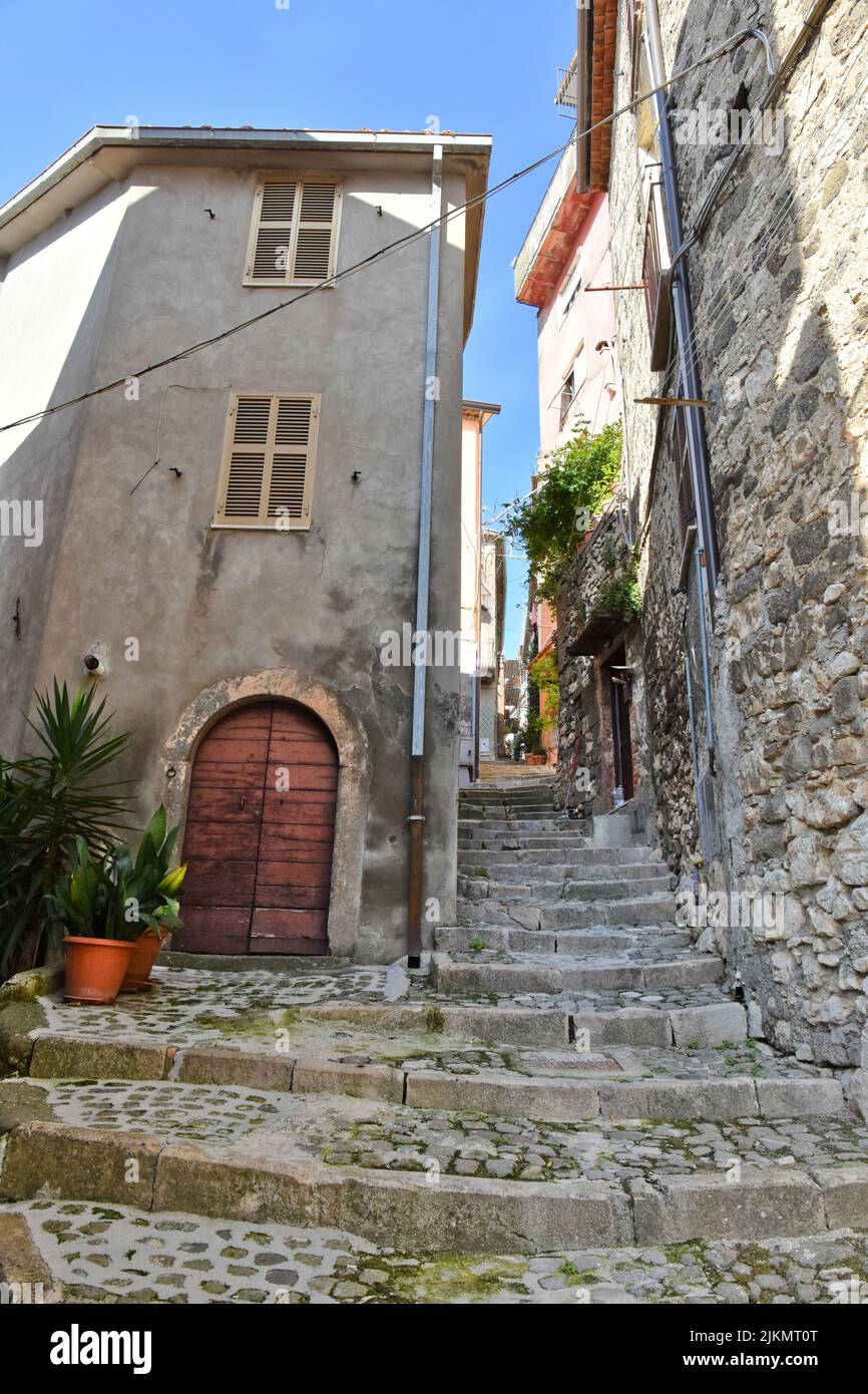 A sunny medieval stairs and a narrow street among the houses of Patrica village in Lazio region, Italy Stock Photo