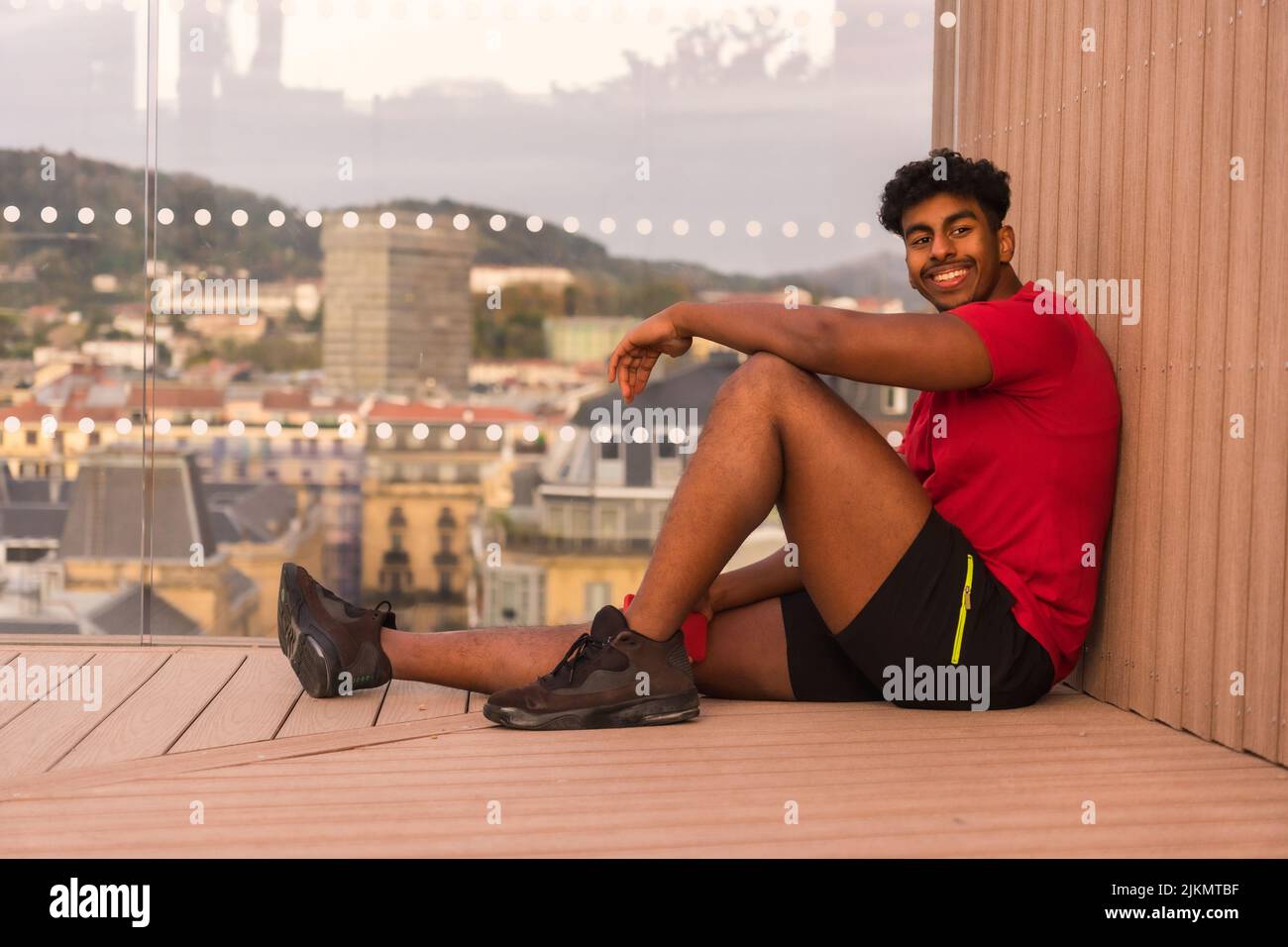 Cheerful young arab man sitting hi-res stock photography and images - Alamy
