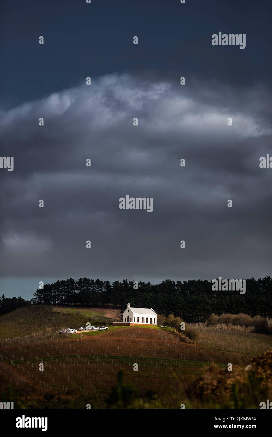 A vertical shot of a church in a valley under a gloomy sky in Cape Town ...