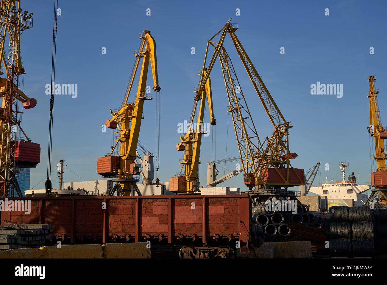 Railway wagon in an industrial port. railway carriage for ore transportation in the commercial sea port Stock Photo