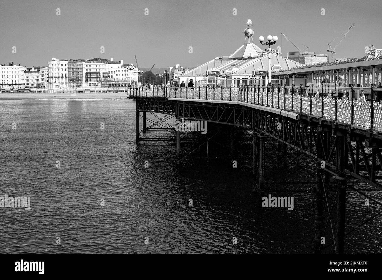 A grayscale shot of Brighton Pier, United Kingdom. Stock Photo
