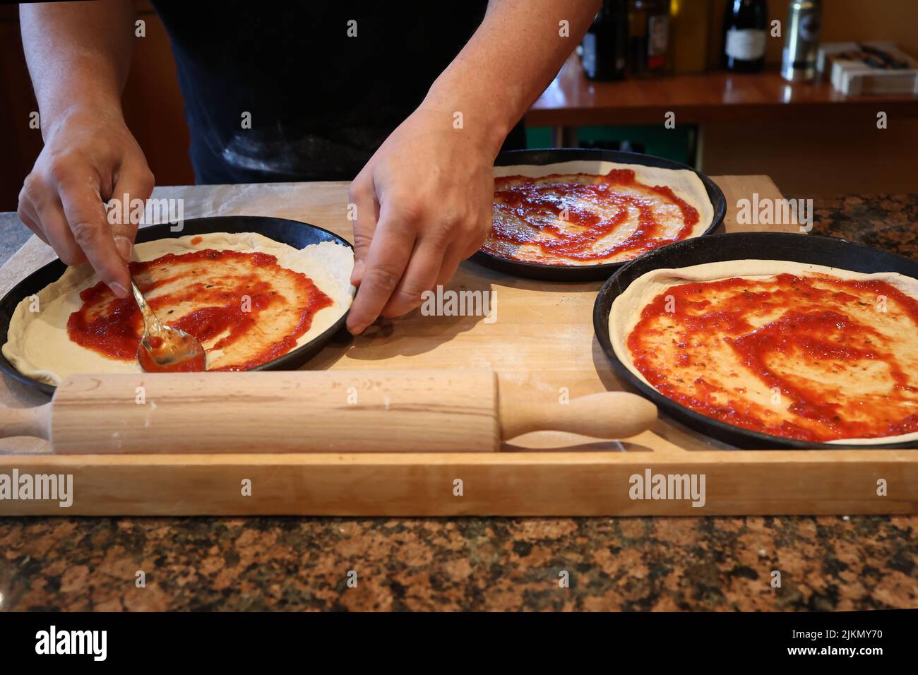Bake original Italian pizza at home Traditional preparation Stock