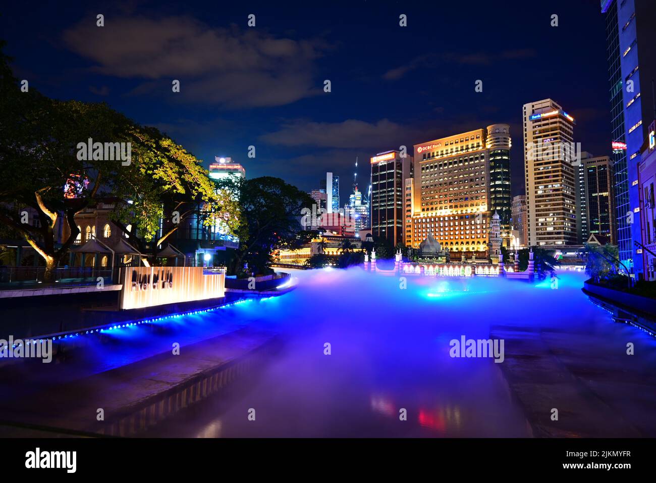 The beautifully illuminated cityscape with modern buildings at night ...