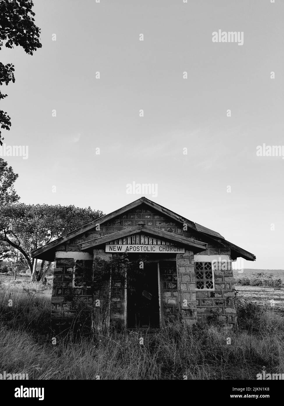 a low angle shot of old stone church in grayscale Stock Photo - Alamy