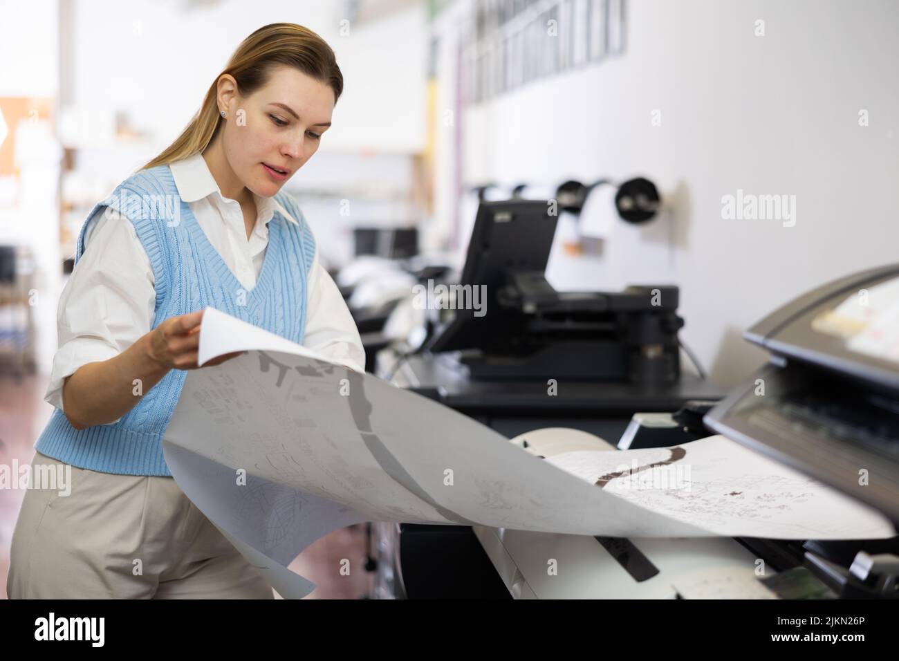 Worker in a printing and press centar check print quality Stock Photo
