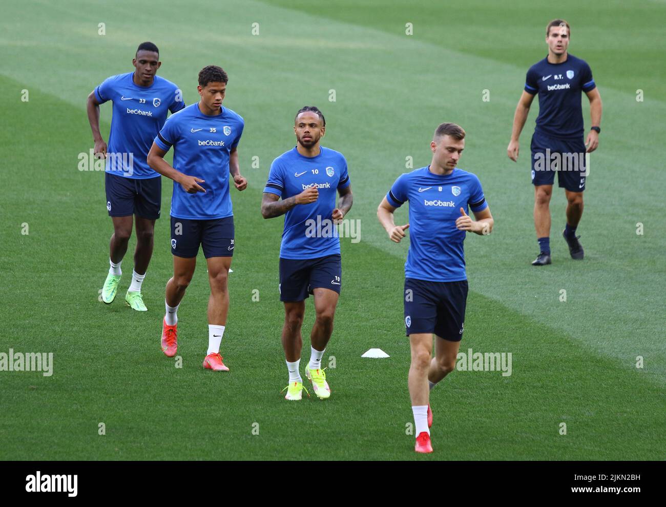 KYIV, UKRAINE - AUGUST 10, 2021: Genk players run during open training session before the UEFA Champions League third qualifying round game against Shakhtar Donetsk in Kyiv Stock Photo