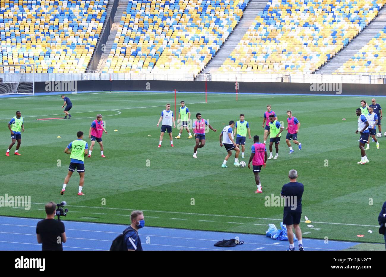 KYIV, UKRAINE - AUGUST 10, 2021: Genk players run during open training session before the UEFA Champions League third qualifying round game against Shakhtar Donetsk in Kyiv Stock Photo