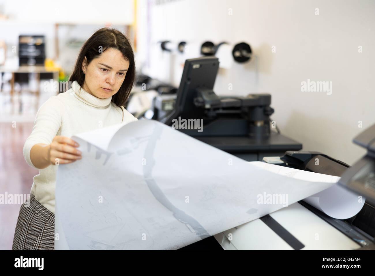 Worker in a printing and press centar check print quality Stock Photo