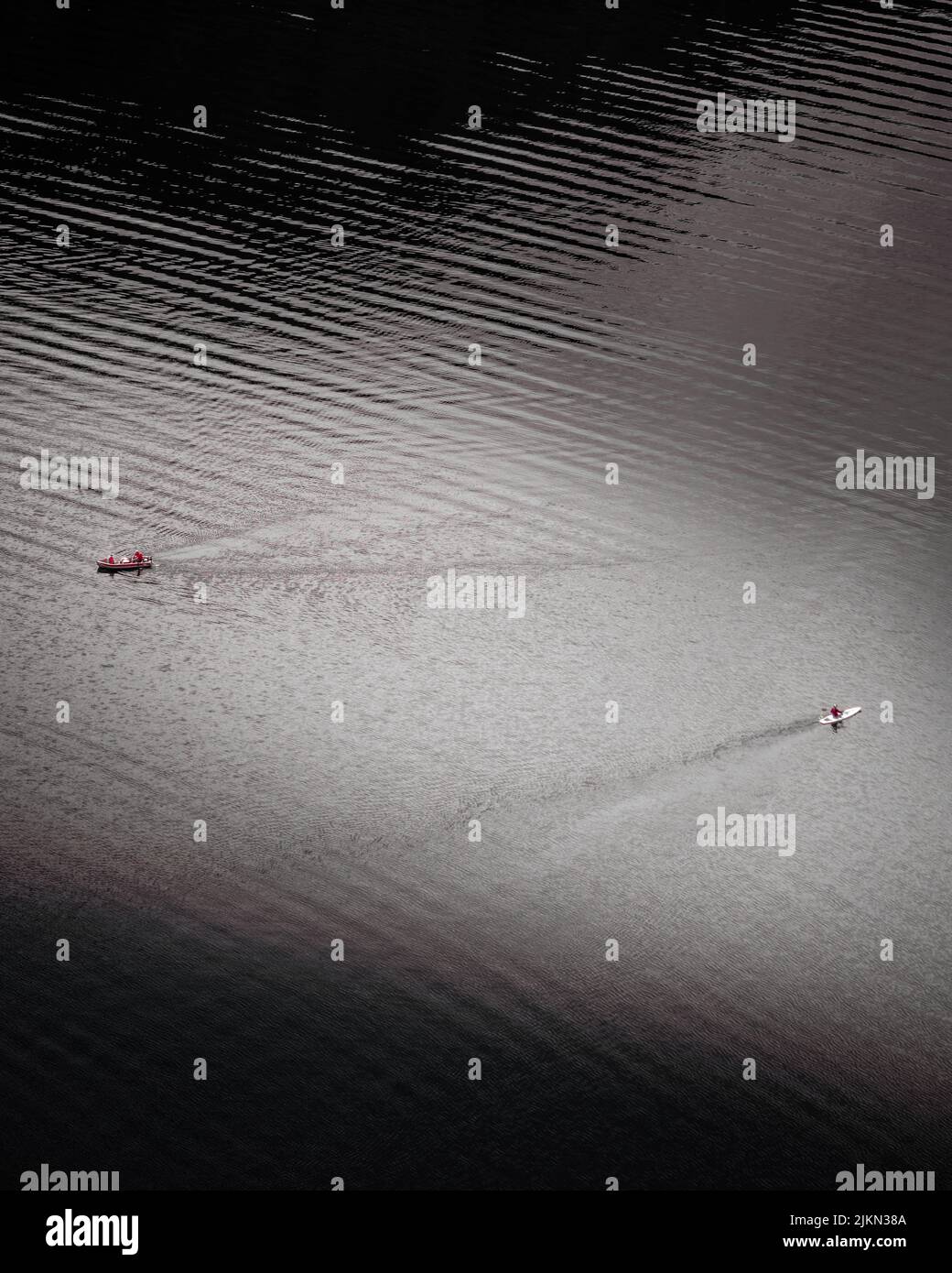 An aerial view of two boats swimming in the calm water Stock Photo - Alamy