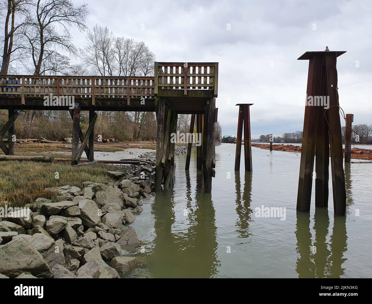 A beautiful shot of a dock near Fraser River in Vancouver Stock Photo