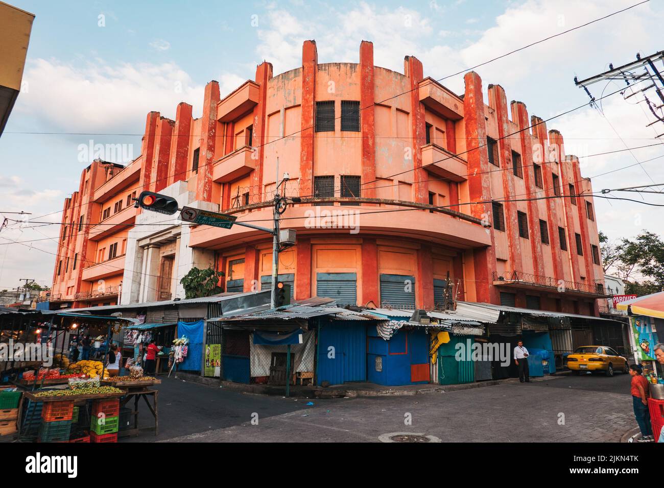 a vibrant orange retro building in central San Salvador, El Salvador Stock Photo