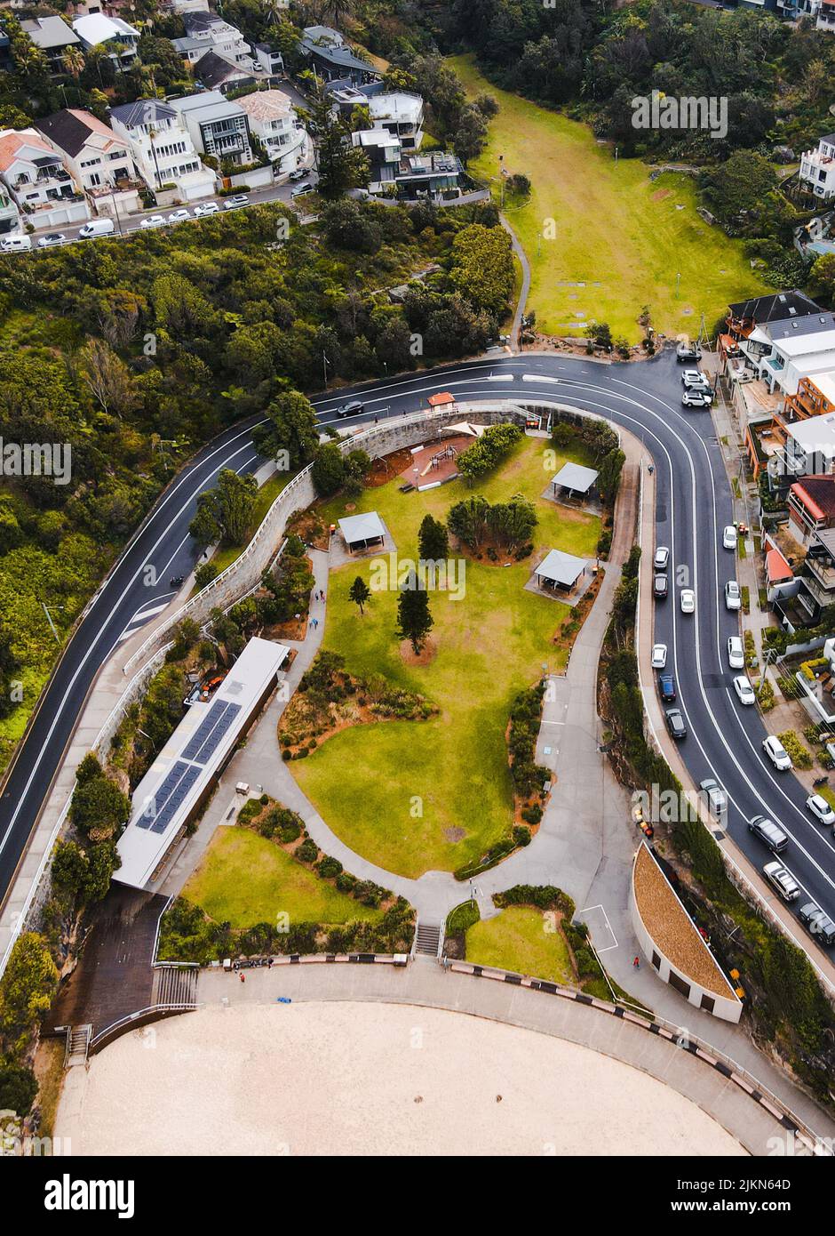 A vertical aerial shot of buildings and a highway at Tamarama Beach, Sydney, Australia Stock Photo