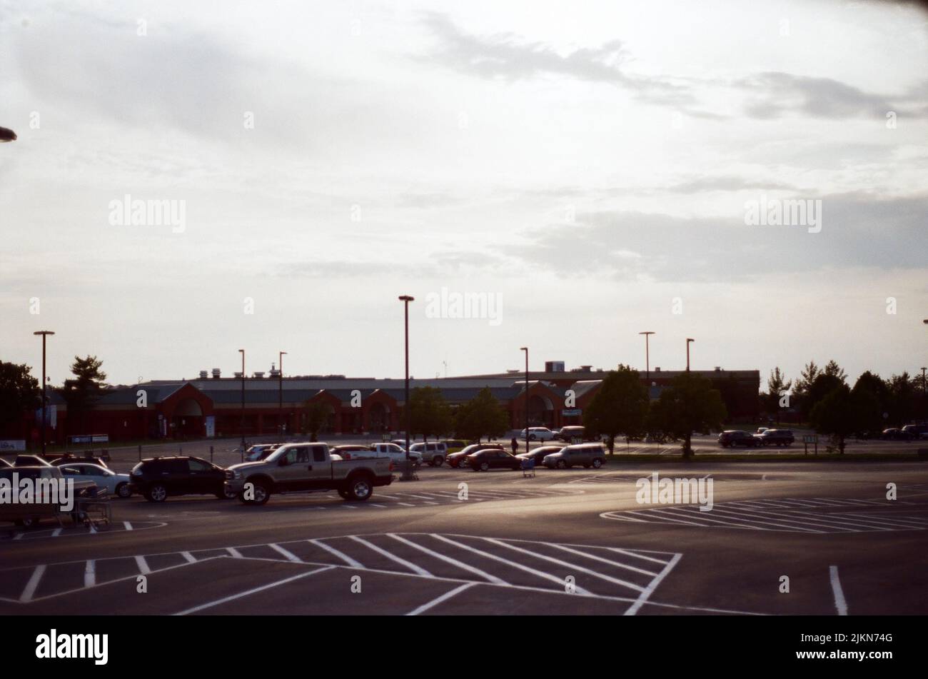 The Vehicles Parked In An Outdoor Parking Lot On A Bright Sky ...